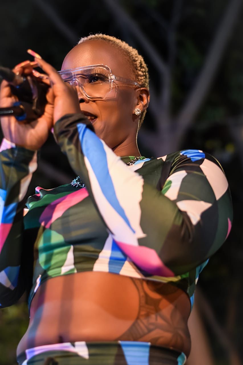 Mizz Gabbzz gesturing during performance