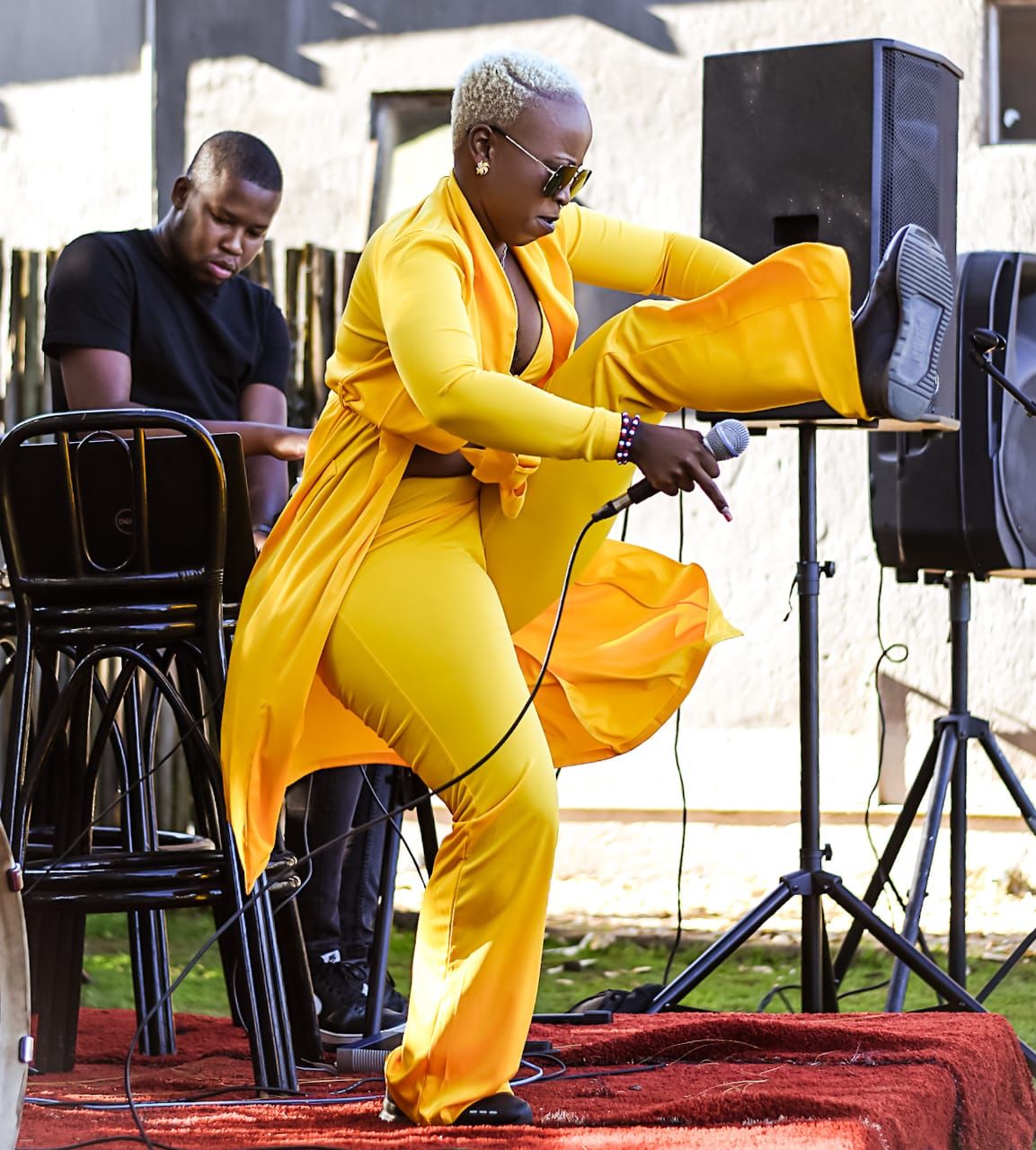 Daytime performance in yellow outfit
