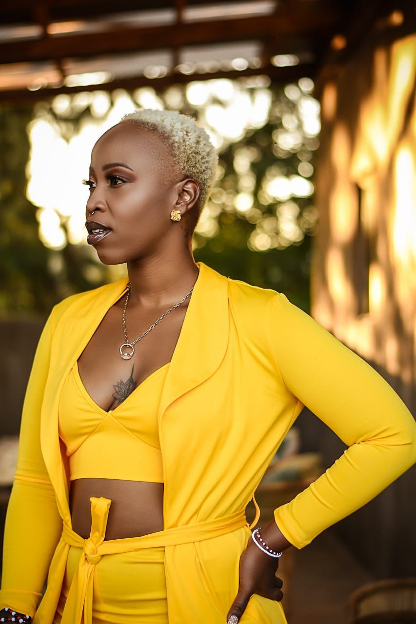 Mizz Gabbzz in golden yellow outfit