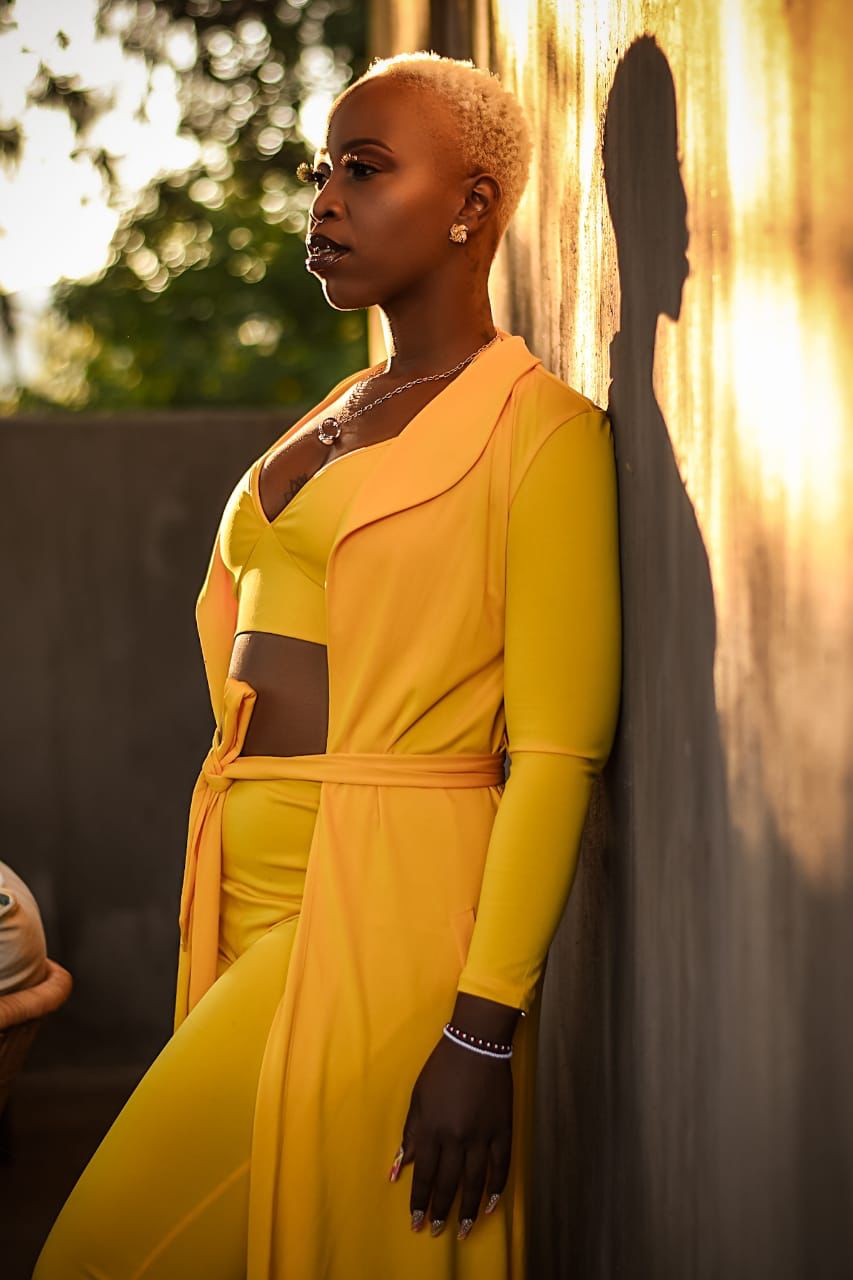 Mizz Gabbzz in golden yellow outfit